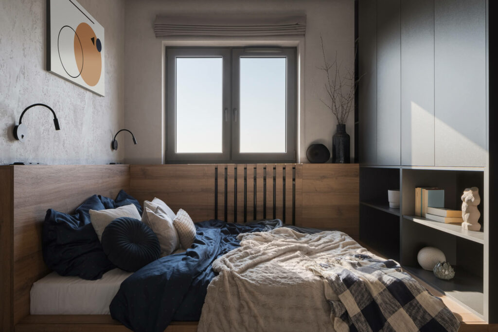 Lit disposé en angle dans une chambre étroite pour dégager un couloir de circulation